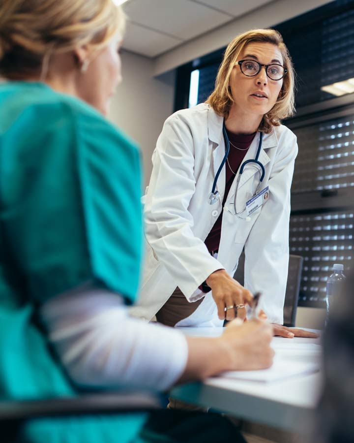 Doctor speaking with medical staff