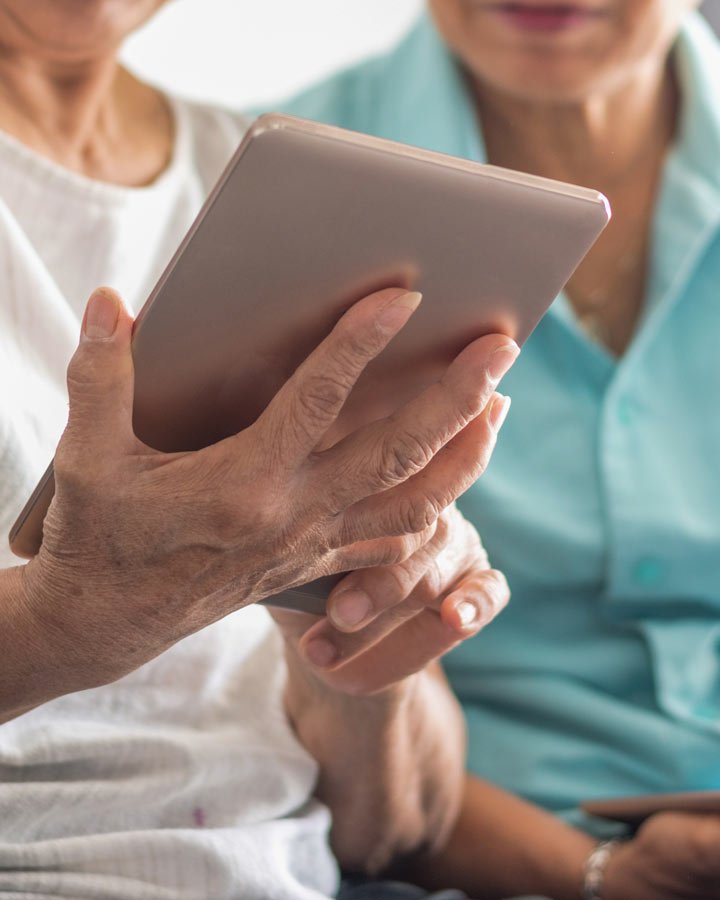 elderly women using tablet