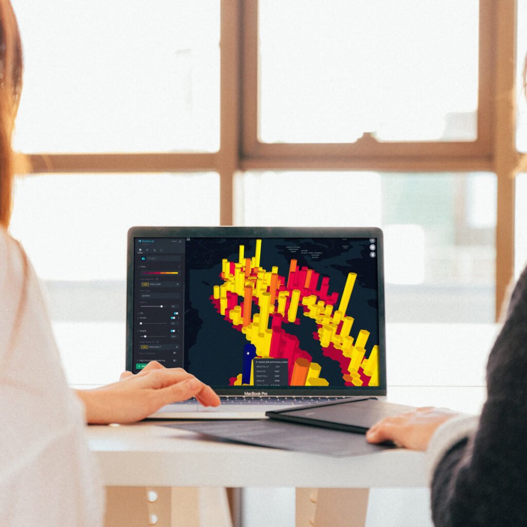 two women using laptop