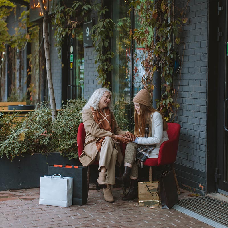 Young adult shopping with older adult